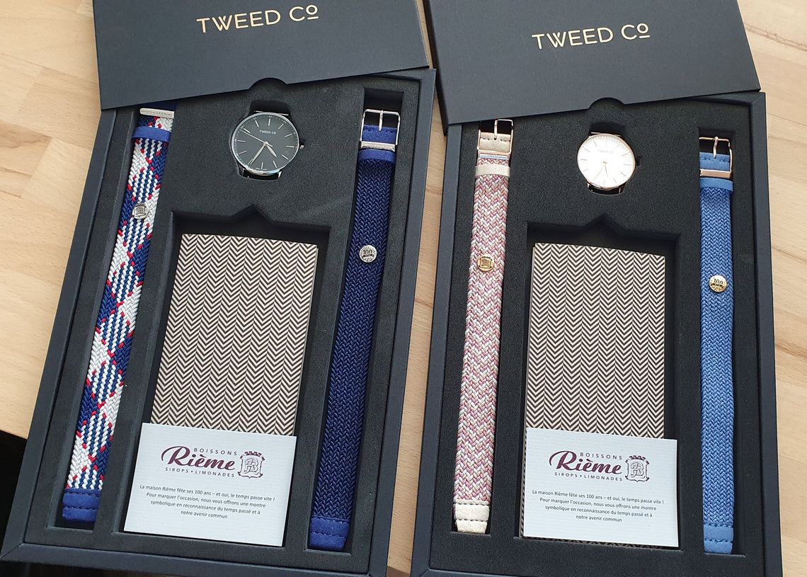 Company director offering personalized Tweed Co. watches to his employees in an elegant gift box.